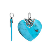 Handcrafted Balinese Sterling Silver Heart Pendant featuring a vivid Turquoise Shell center and ornate filigree bail, crafted for women who love artful island-inspired jewelry.